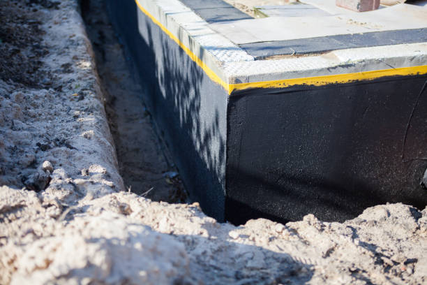 Professional Waterproofing technician working in Romulus, MI